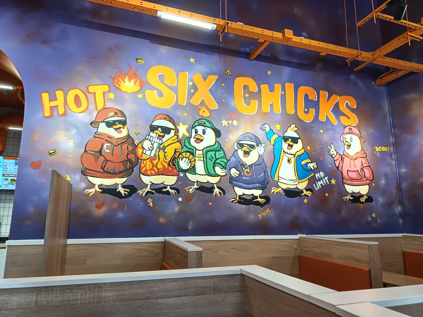 The six Six Chicks characters painted on the restaurant wall